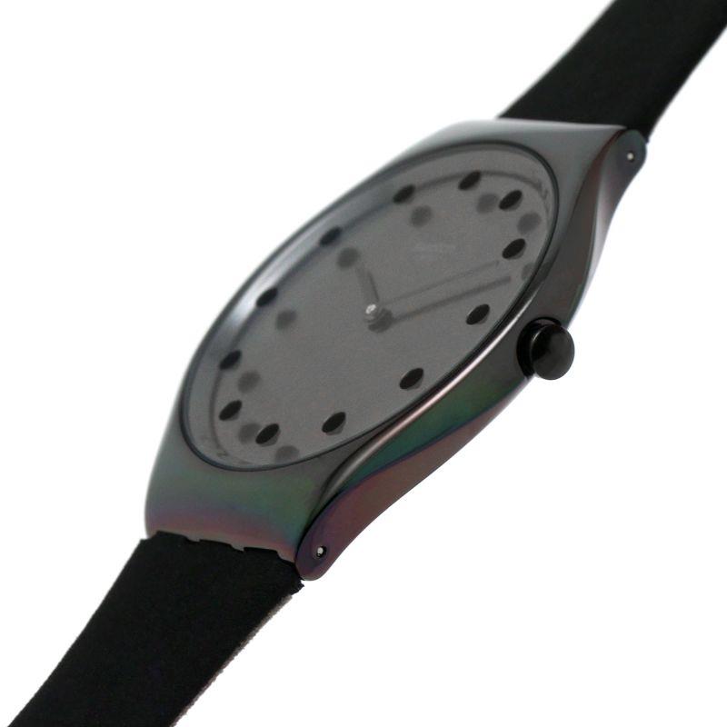 Ladies black leather-strap watch angled view with dark dial and metal bezel