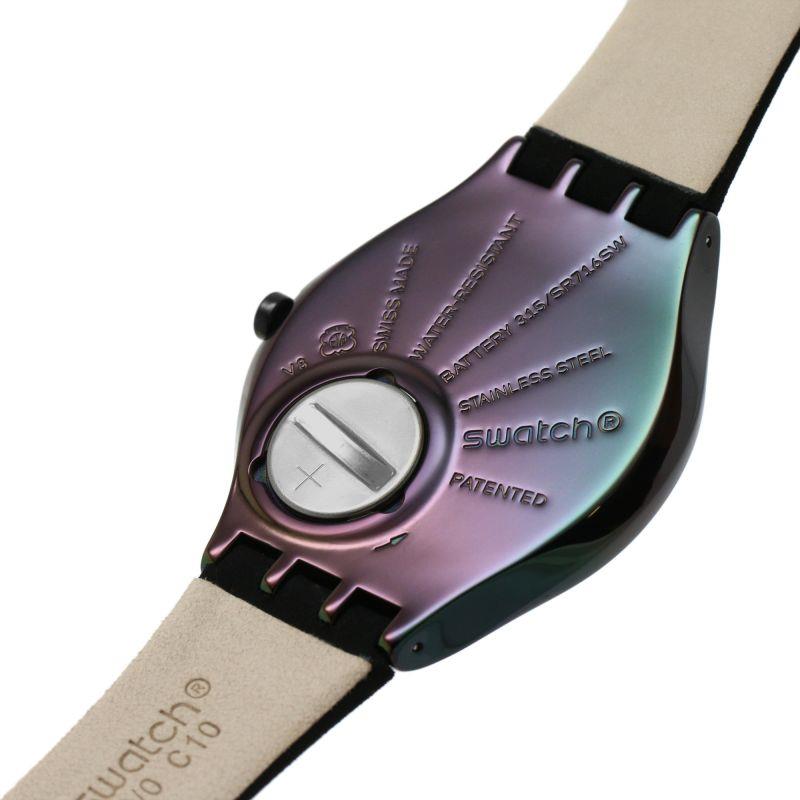 Ladies black watch close-up: dark dial, round black case, side crown