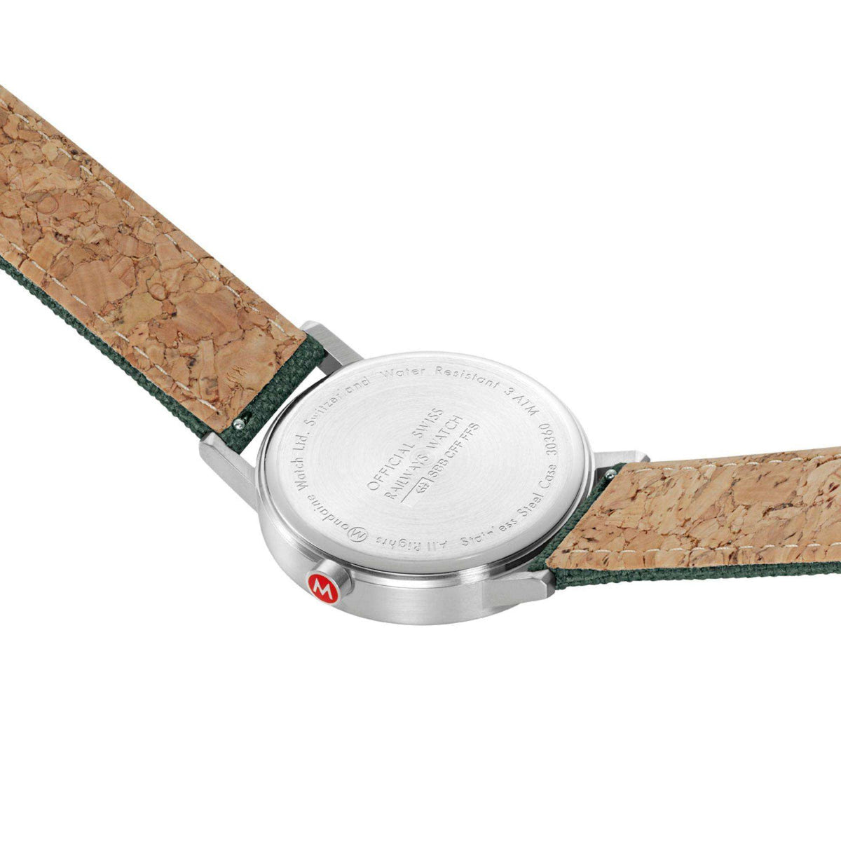 Mondaine Classic watch underside with engraved back and green strap with tan cork-style lining.