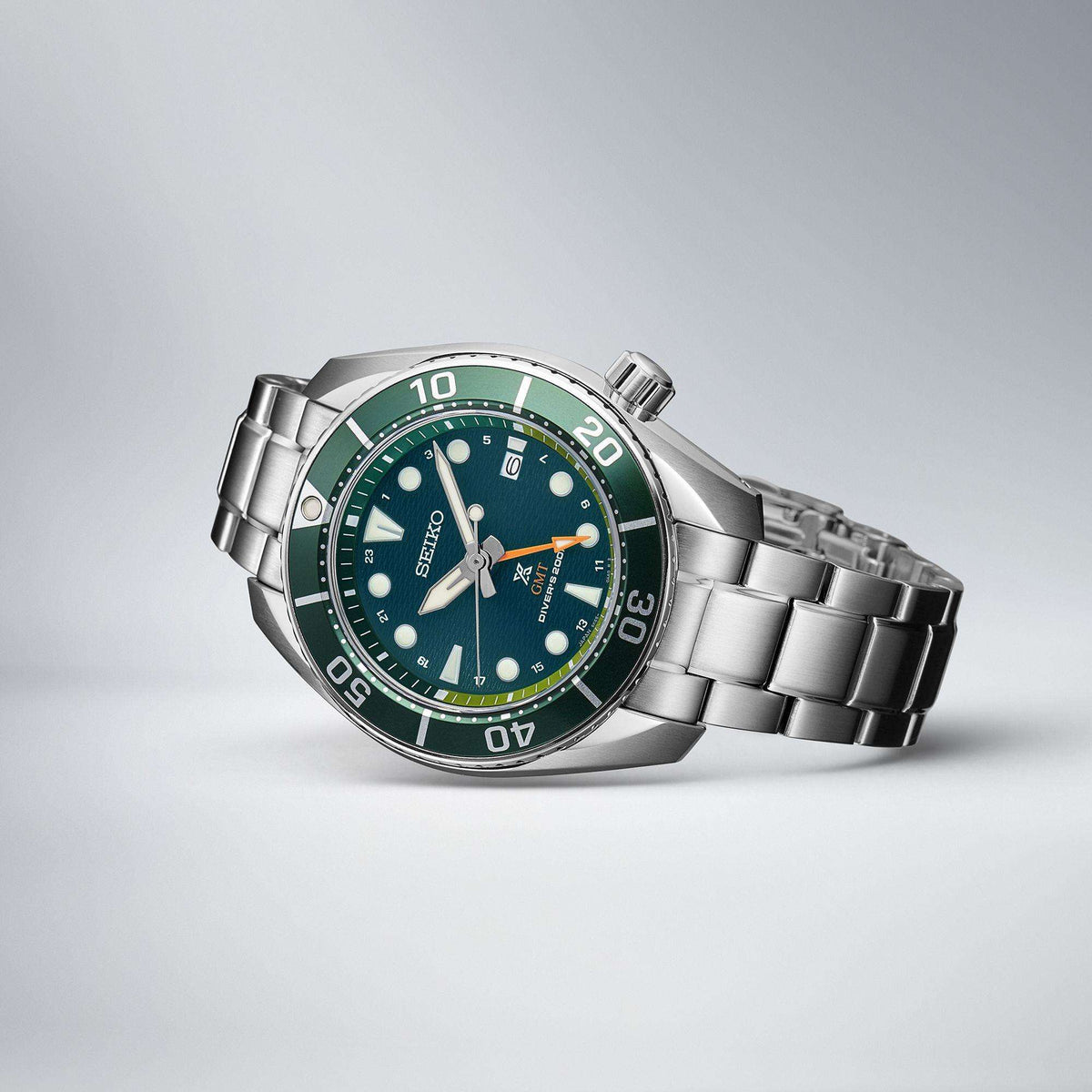 Seiko Prospex Aqua Sumo GMT mens watch SFK003J1 resting on its side to display the stainless steel bracelet and case profile