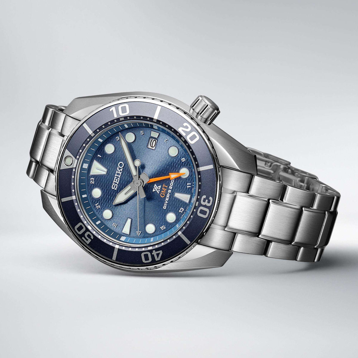 Seiko Prospex SFK001J1 watch with a blue dial on a light gray background