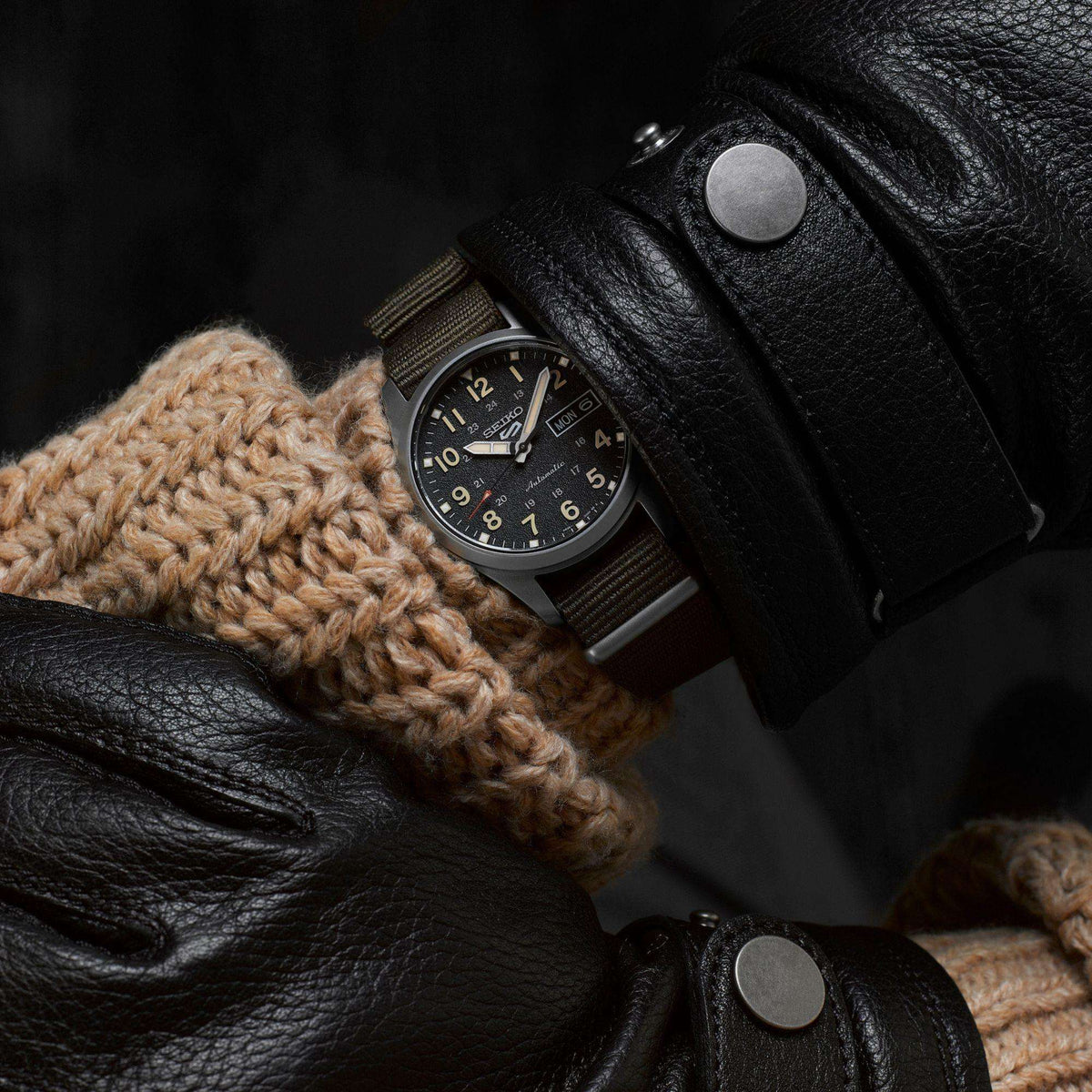 Seiko 5 Sports Midfield SRPJ85K1 on wrist with black leather jacket lifestyle view