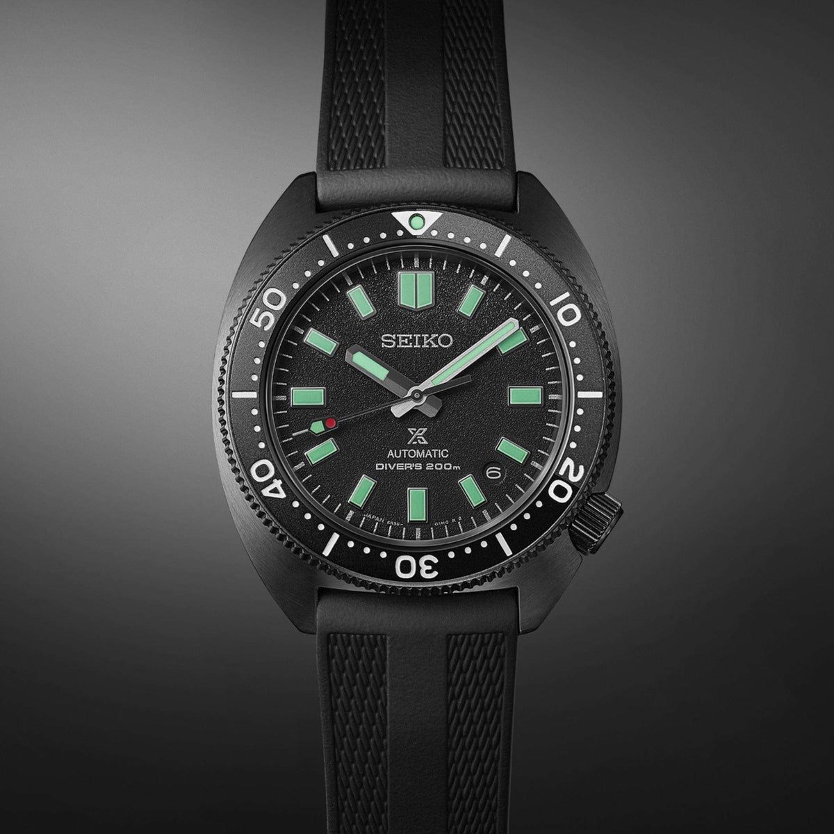 Seiko Prospex Black Series Night Turtle automatic watch SPB335J1 displaying the black dial and bezel against a dark background