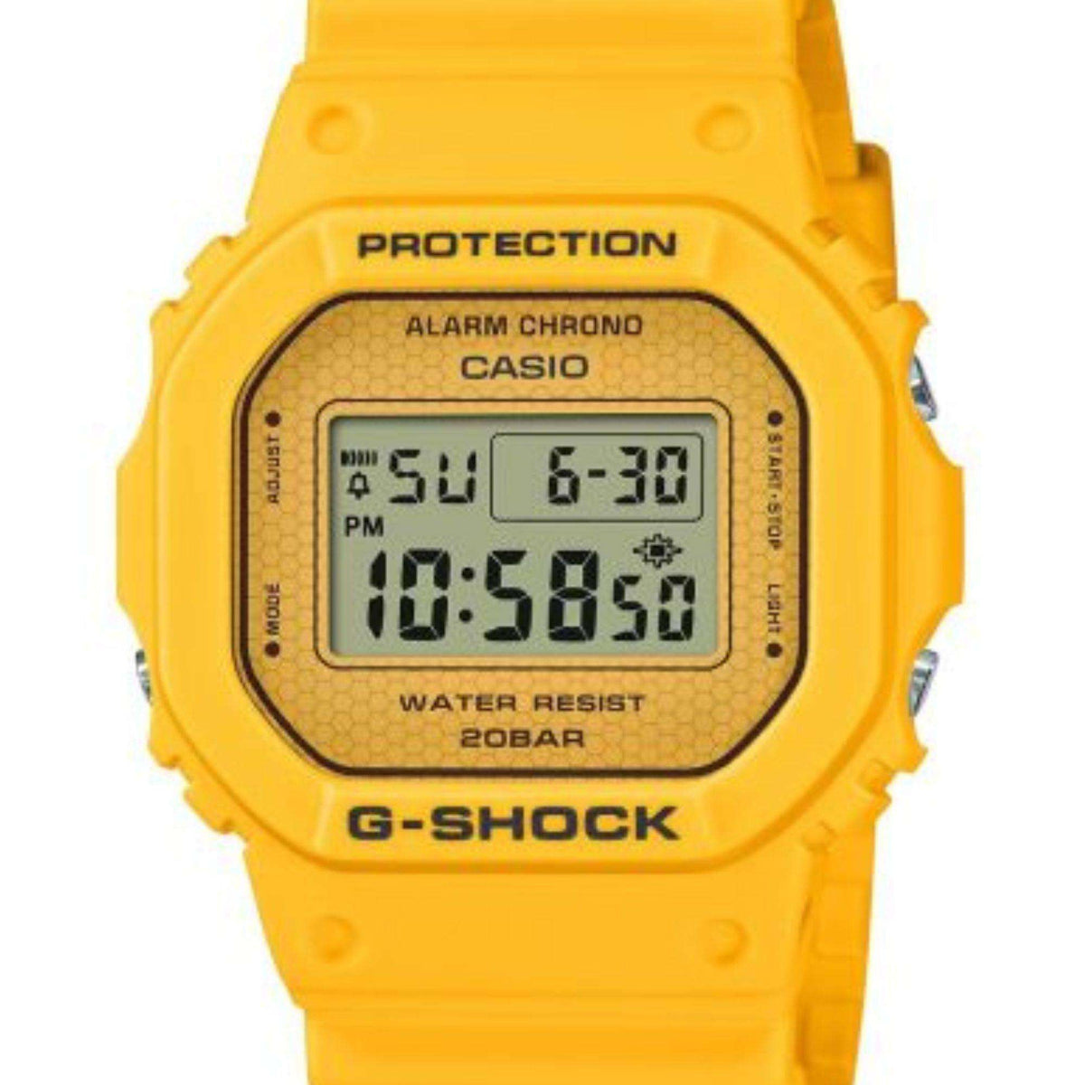 Digital G-Shock watch close-up with yellow rubber strap and LCD showing time and alarm chrono