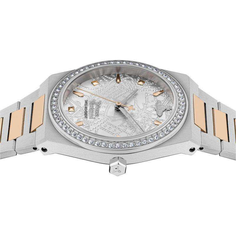 Silver watch angled view with crystal bezel and rose-gold link accents over patterned dial
