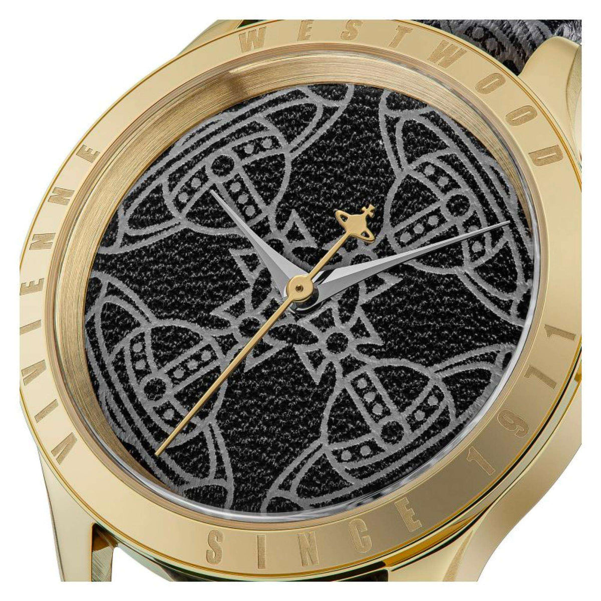 Gold-tone round watch face with black patterned dial, gold hands, star-shaped hour marker