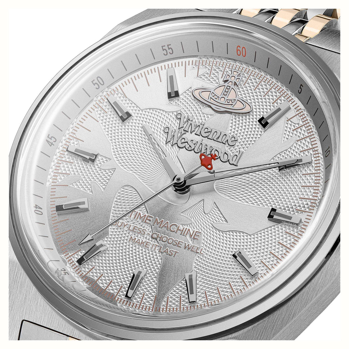 Close-up of silver textured dial with baton markers, Vivienne Westwood logo and hands