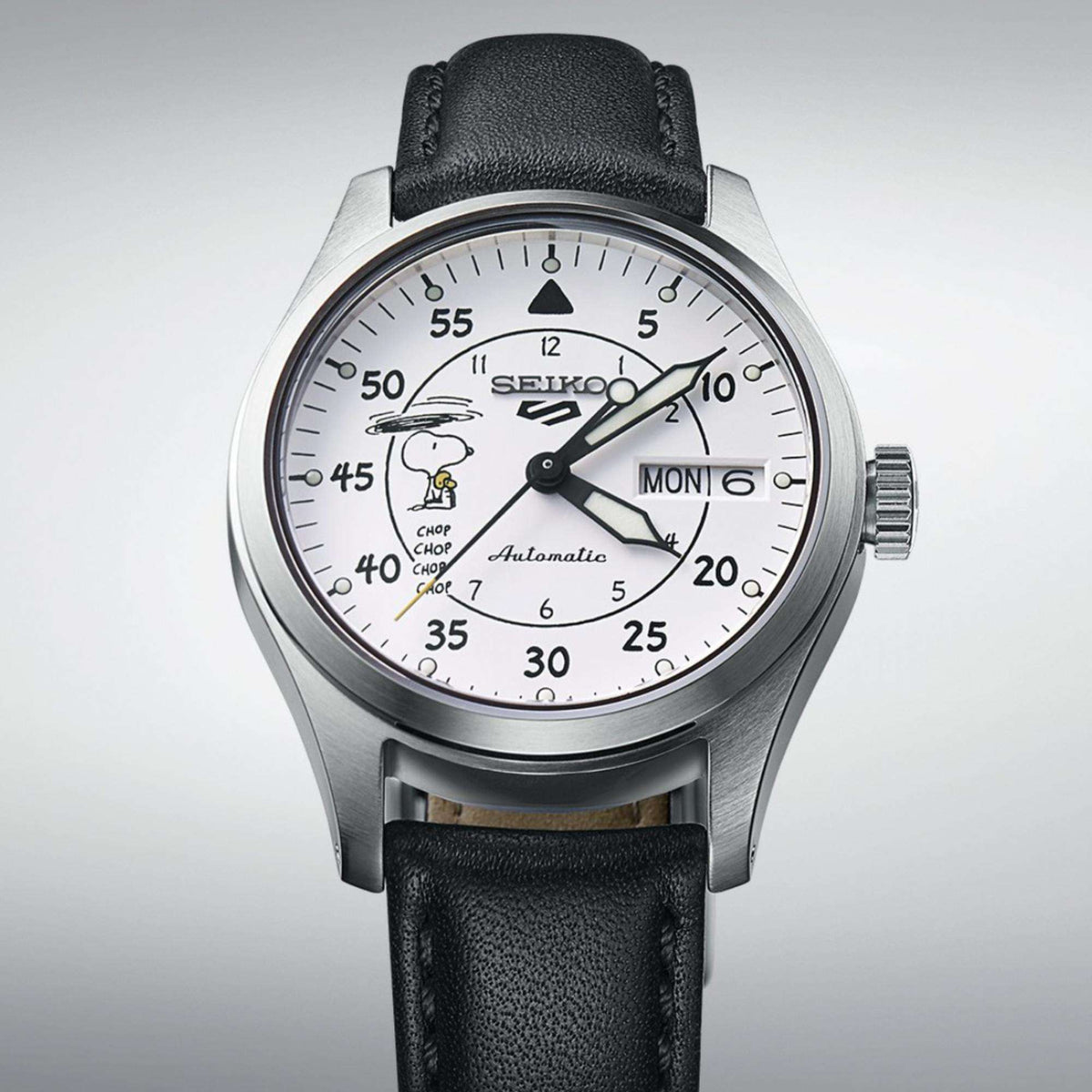 Automatic watch with white dial, Snoopy graphic, black leather strap and steel bezel