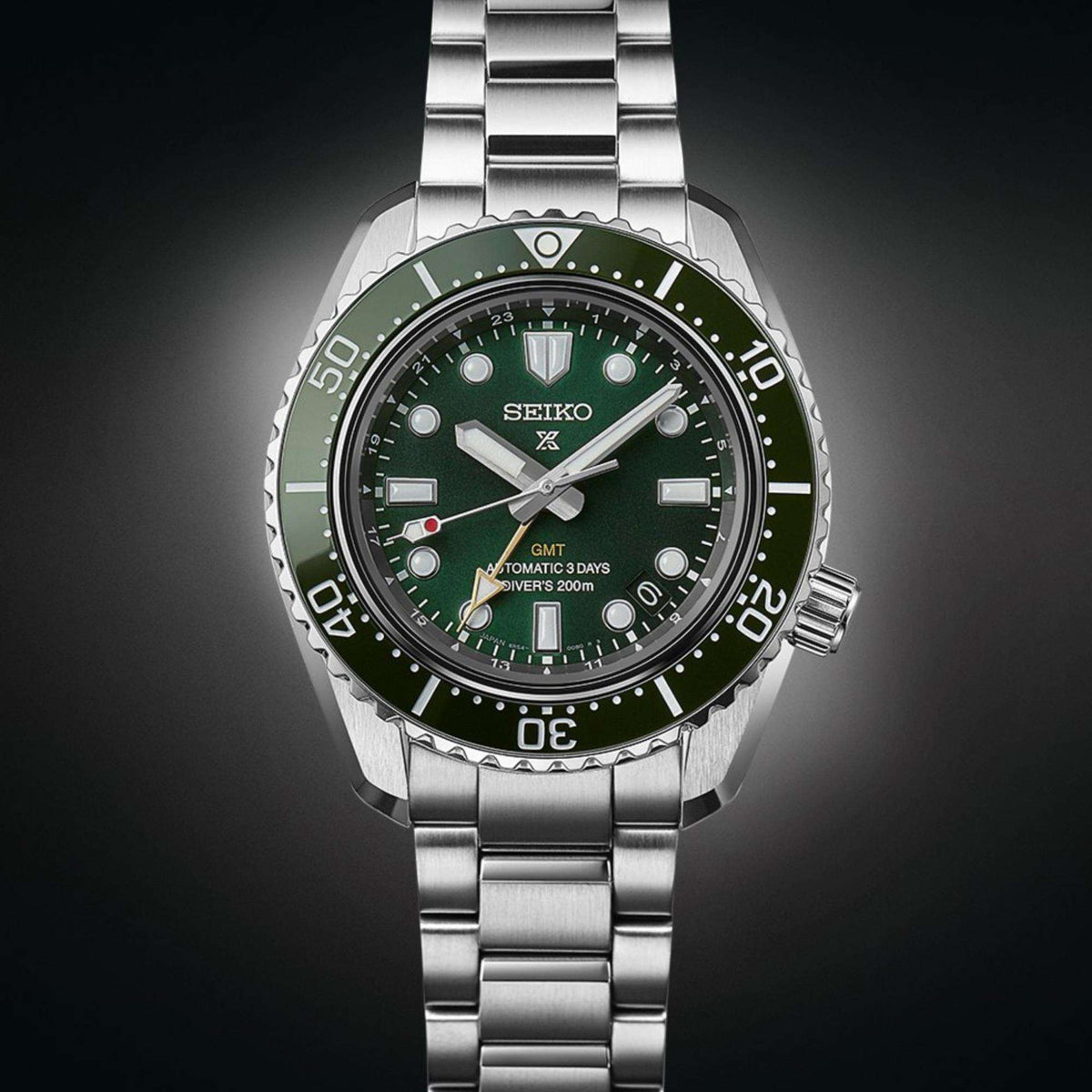 Seiko Prospex SPB381J1 stainless steel case and green dial front view on a dark background