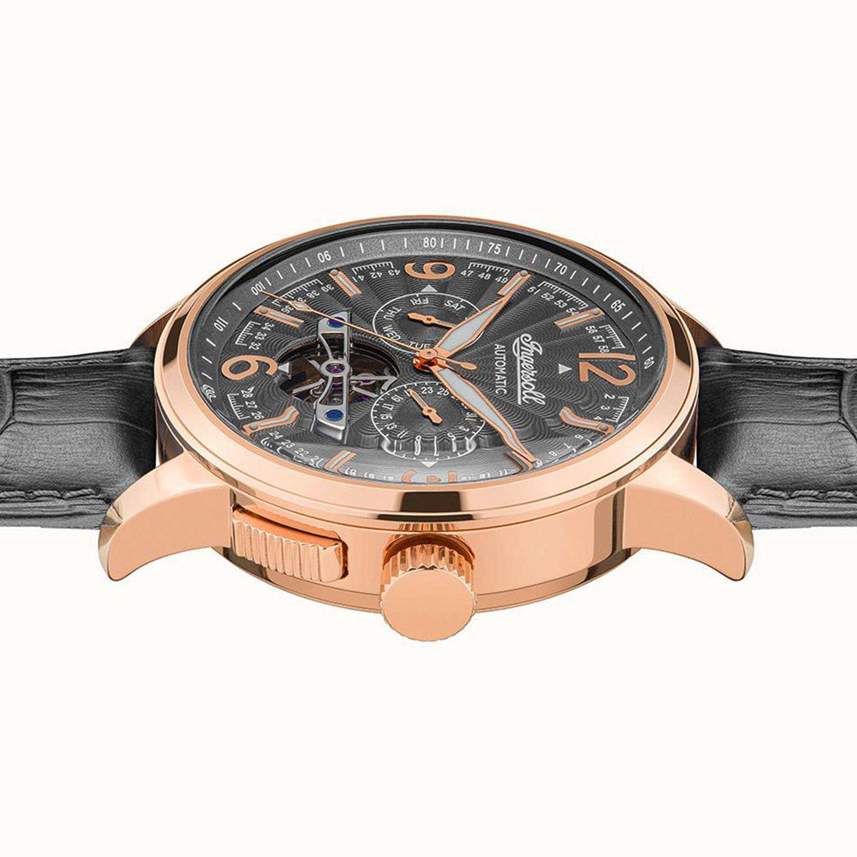 Ingersoll automatic watch angled side view with rose-gold case and black leather strap.