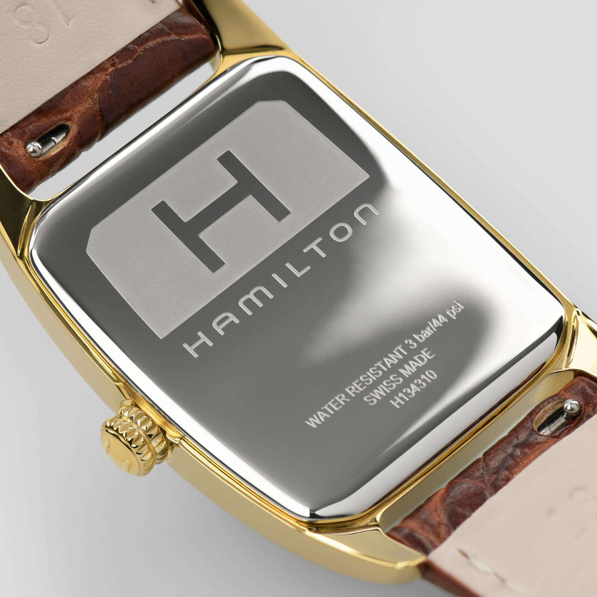 Hamilton American Classic Boulton H13431553 watch rear profile showing stainless steel backplate with brand engraving and gold crown