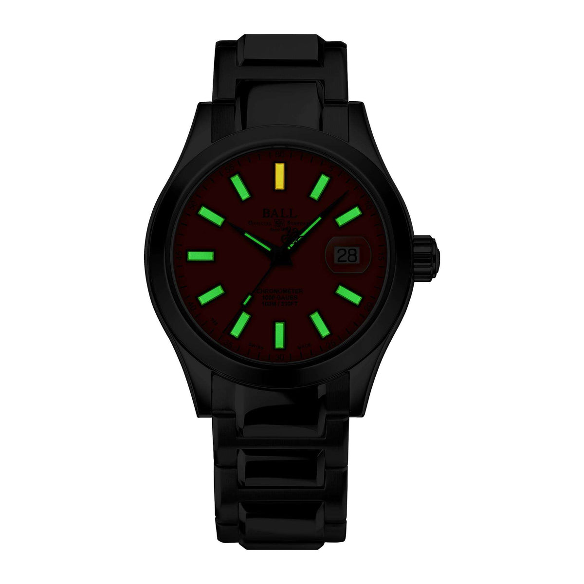 Black rubber men’s watch with dark dial, green hour markers, and date window