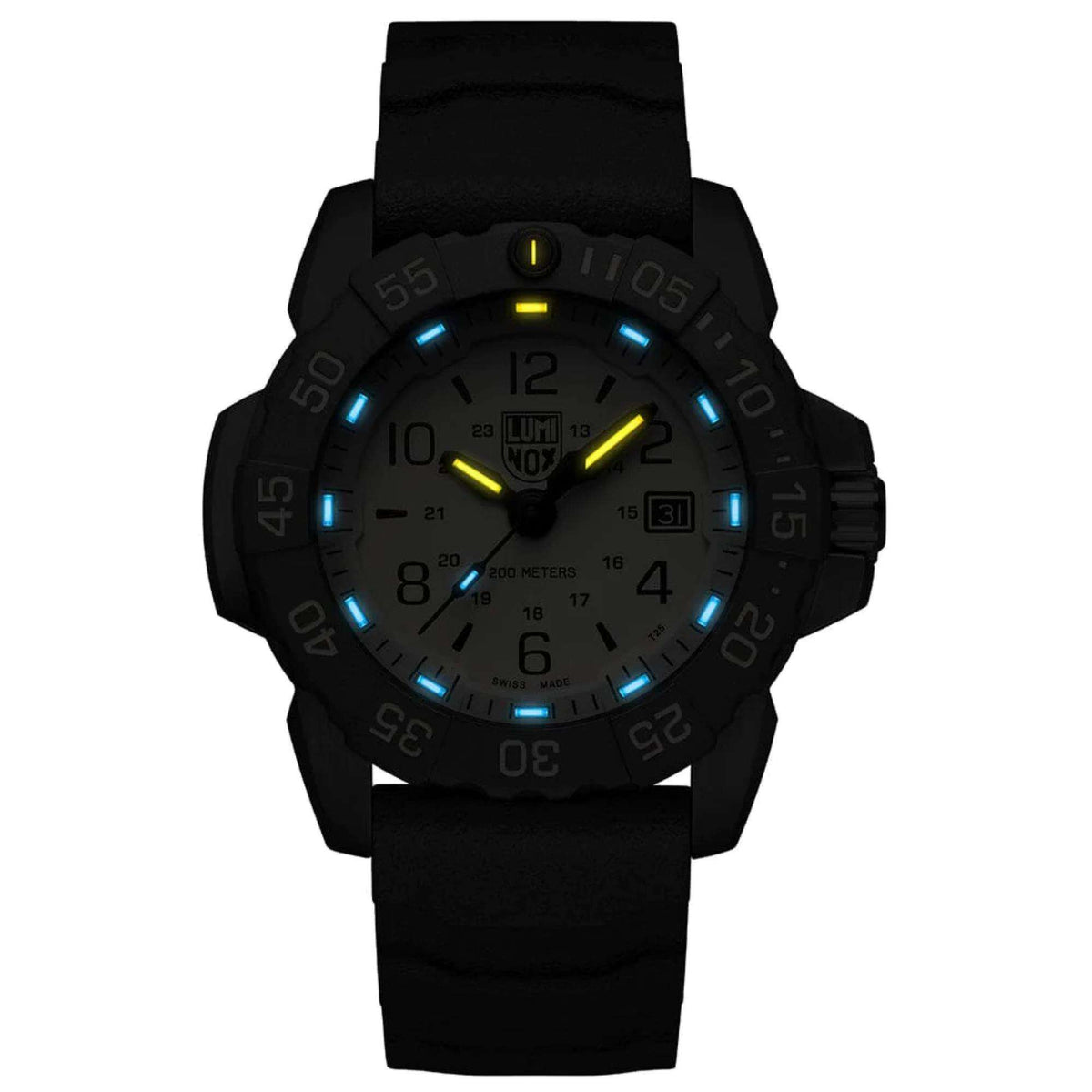 Men's dive watch on black silicone strap, beige dial glowing blue and yellow at night.