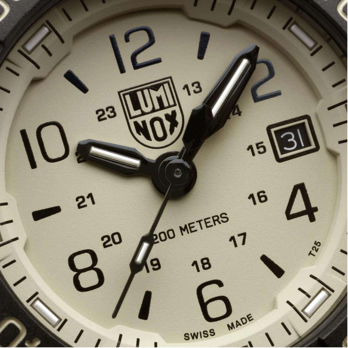 Beige dial of men's dive watch with LUMINOX NOX logo, luminous hands, and date window.