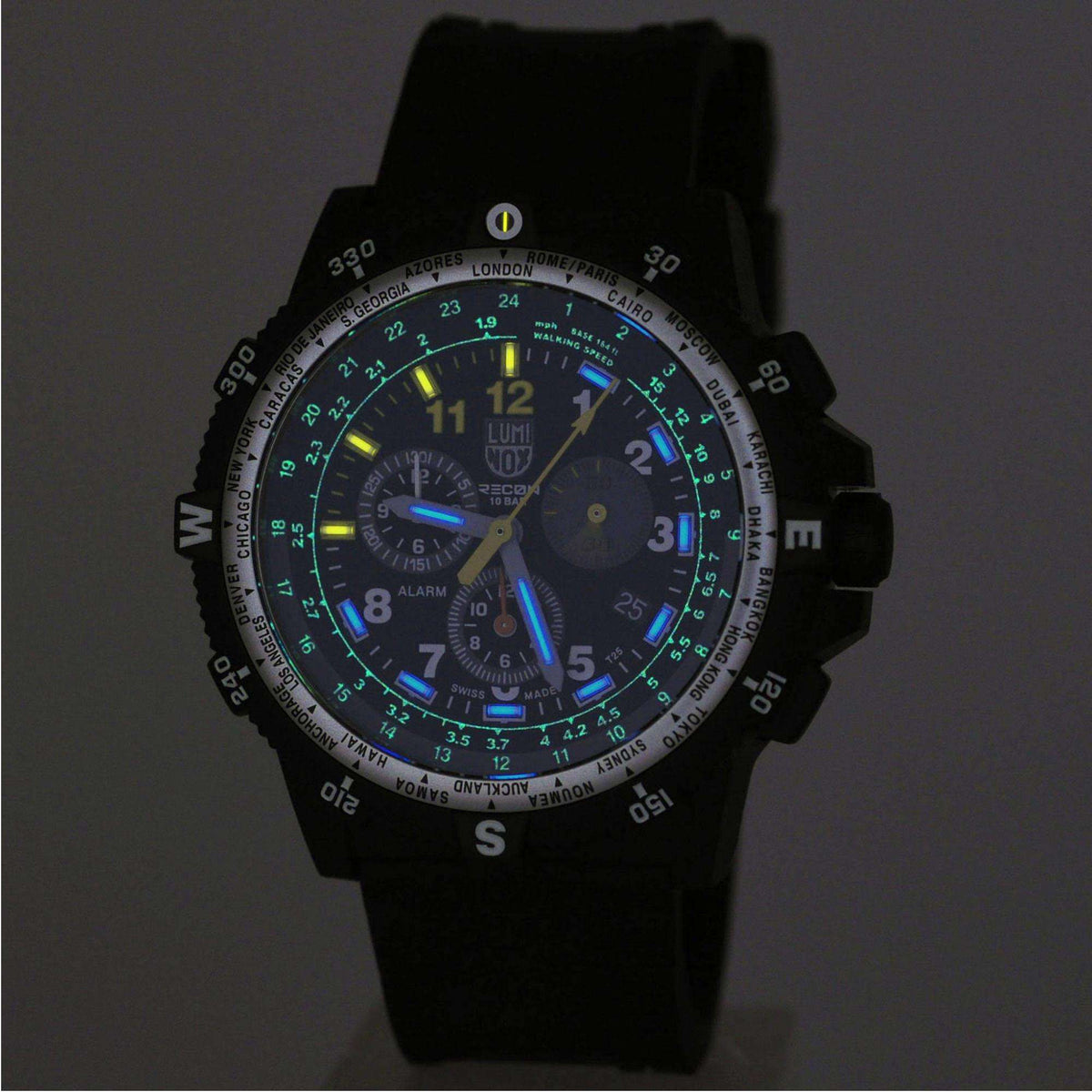 Black chronograph wristwatch with blue and green luminous accents on dial, three subdials