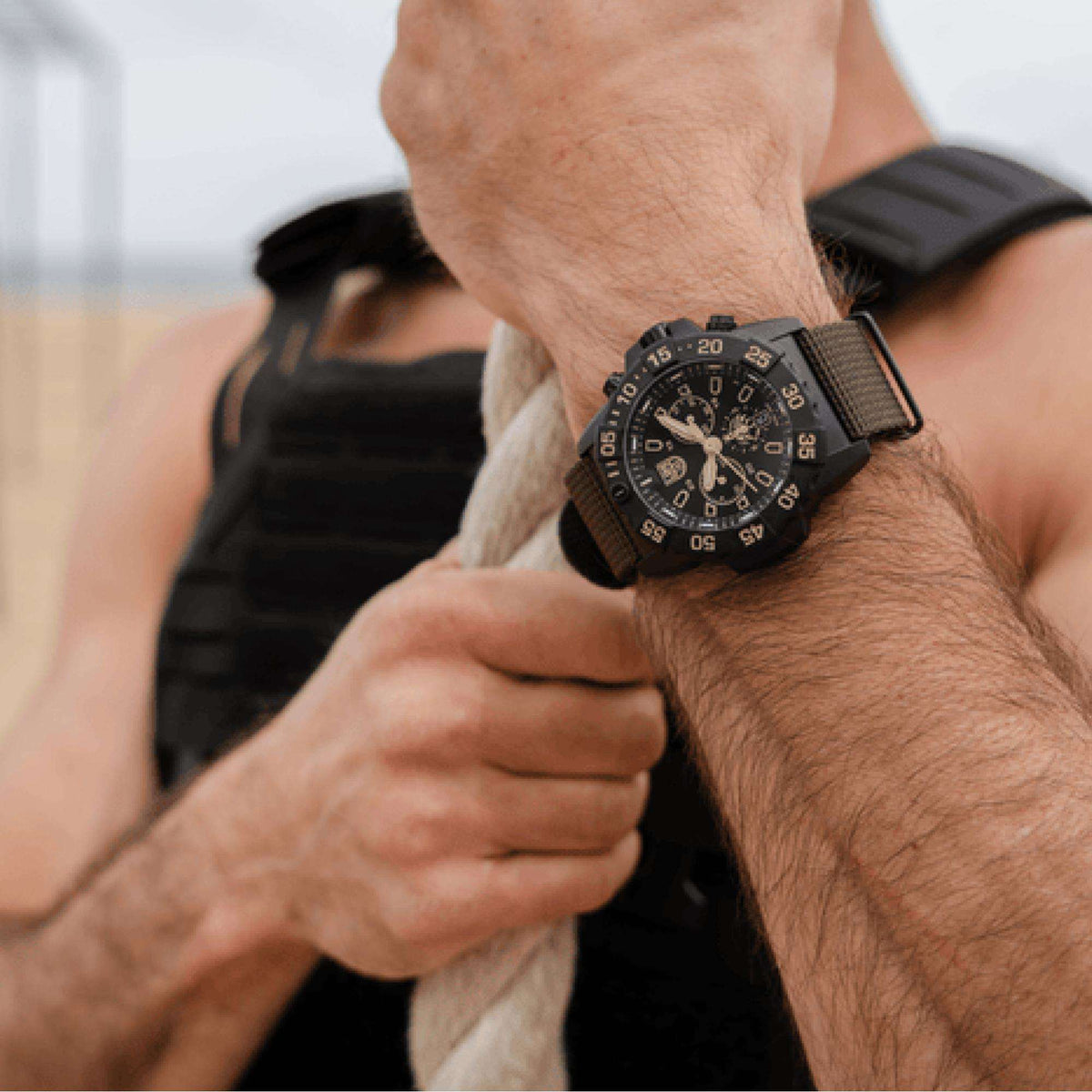 Luminox chronograph watch with black dial and dark rubber strap on a wrist