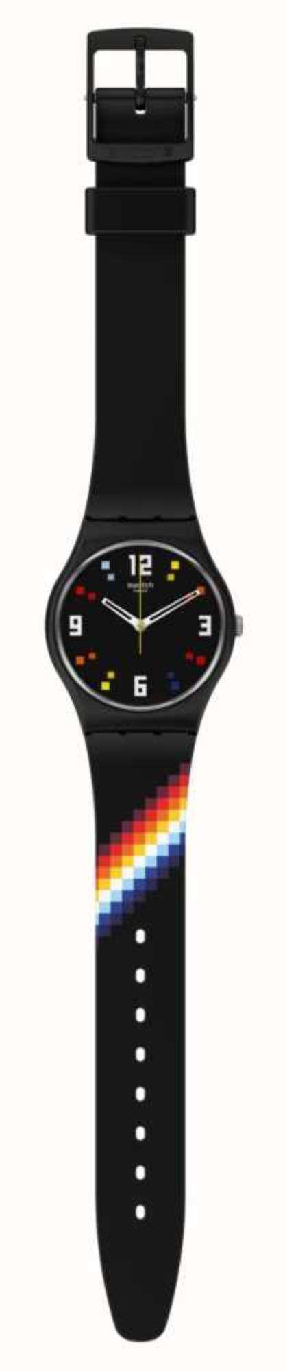 Black Swatch wristwatch on display, black strap with rainbow stripe near the lower side.