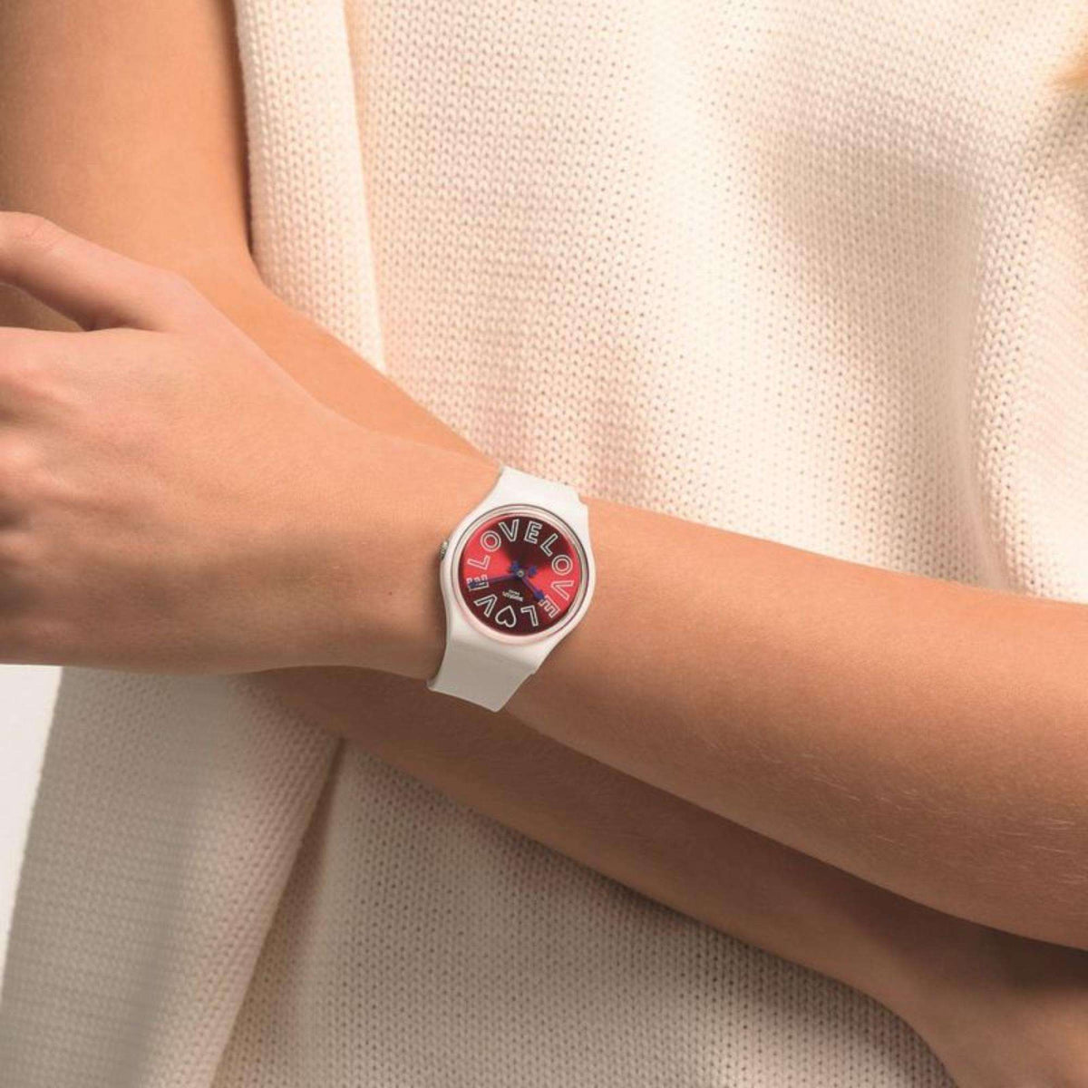Swatch PUREST LOVE gent watch on arm with white band and round red love dial