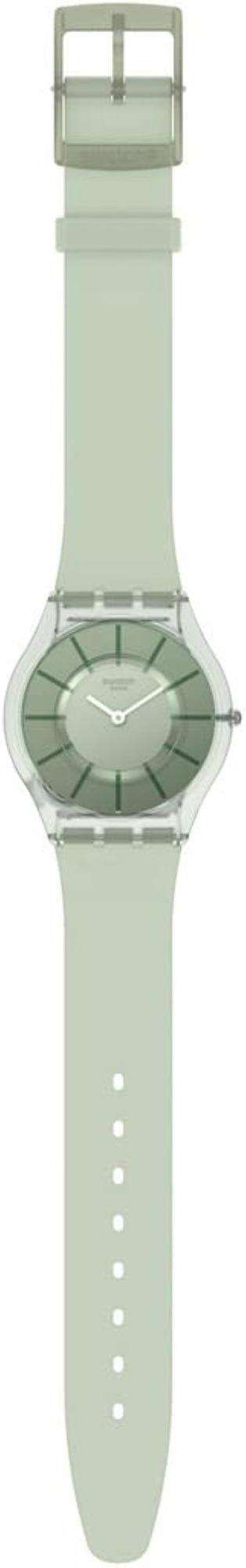 Swatch wristwatch side view, light green strap with dial window and silver crown.