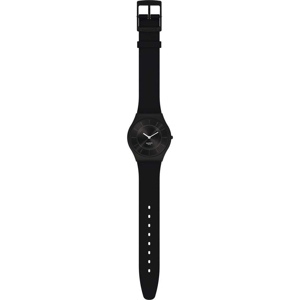 Men's black watch on rubber strap, side view with square buckle