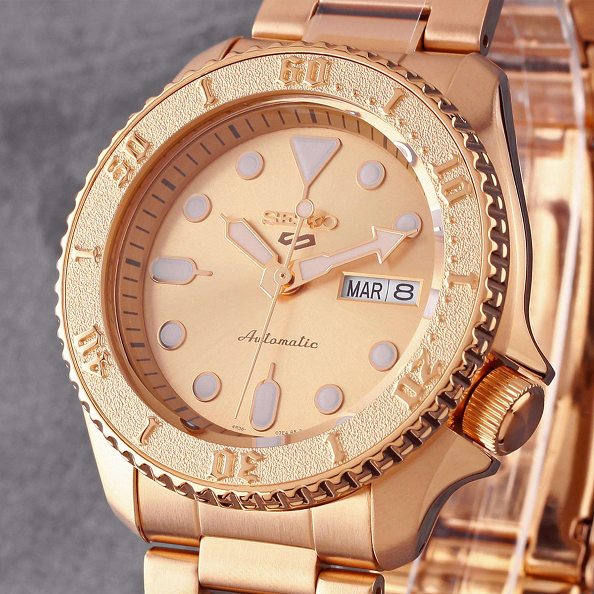 Seiko 5 Sports SRPE72K1 rose gold dial angled front view