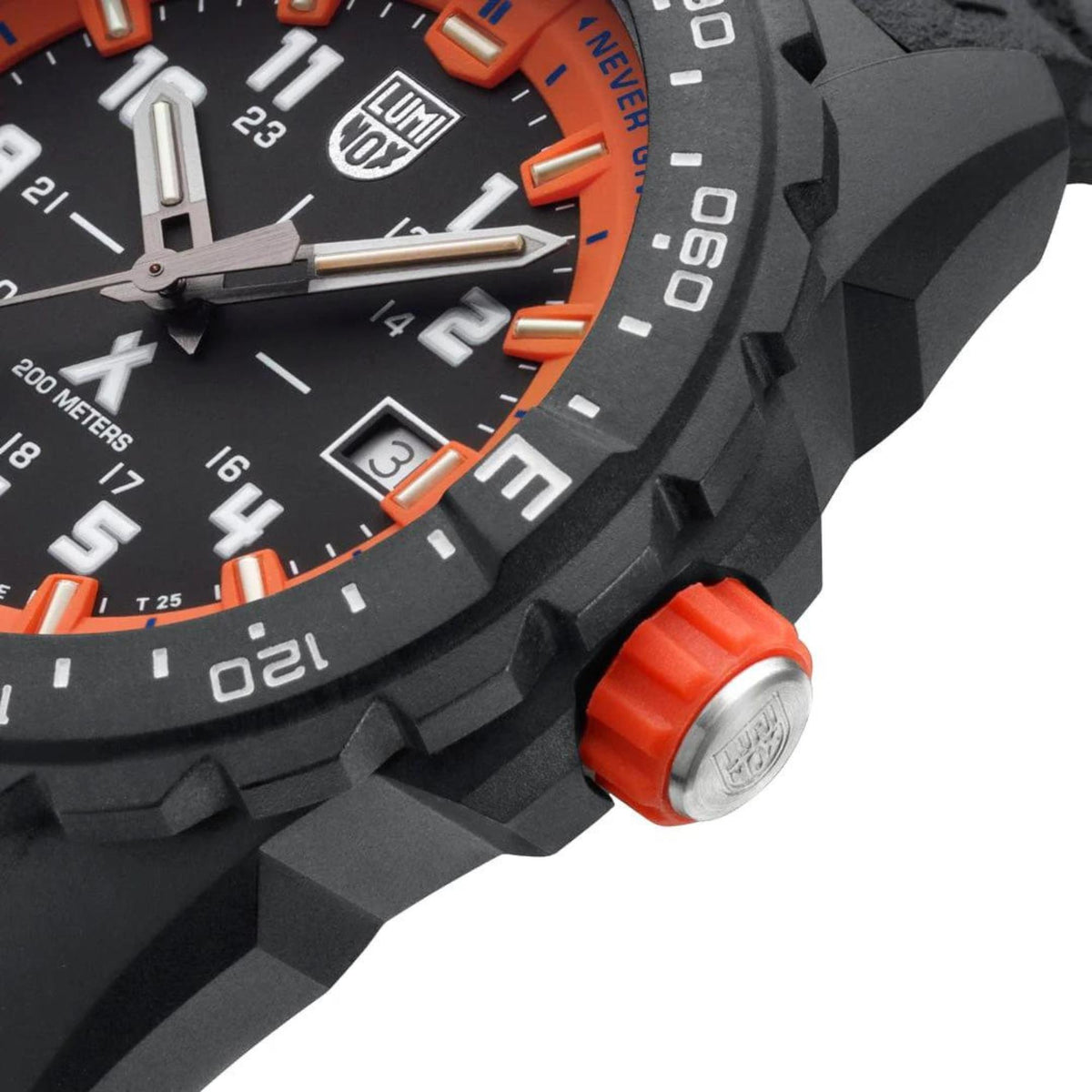 Close-up of orange dial markings and black bezel with orange screw-down style crown.