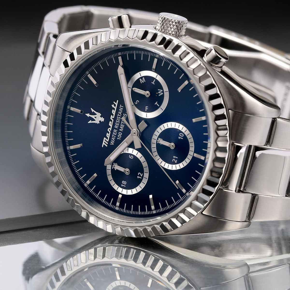 Close-up of Maserati chronograph watch: blue dial, steel case, subdials