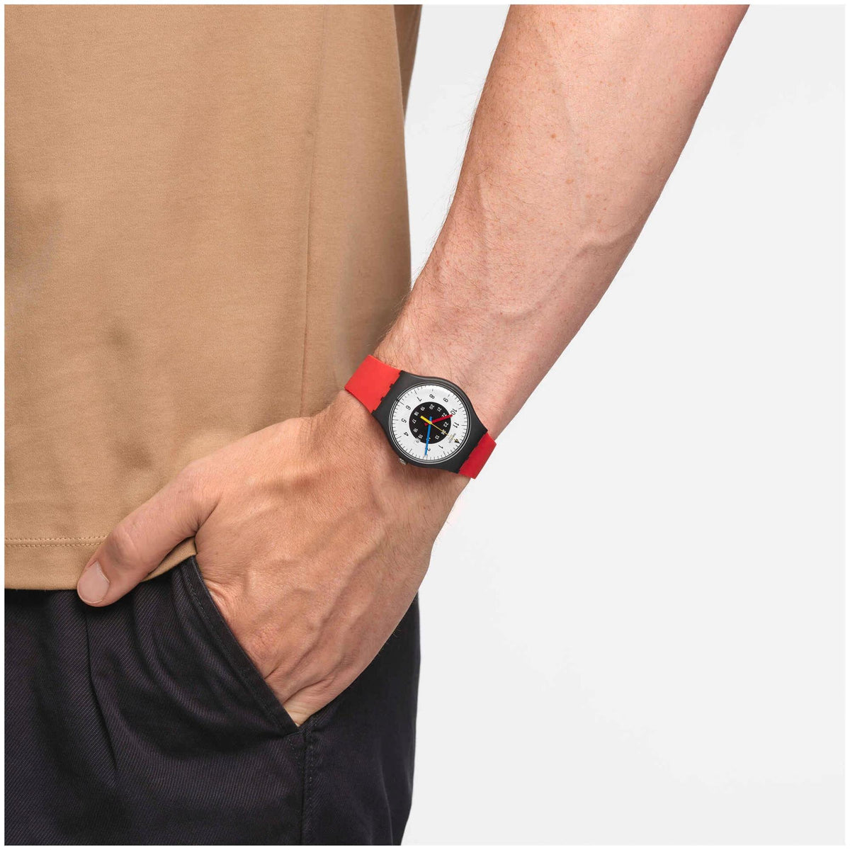 Swatch Gent watch on wrist with red silicone strap and white dial, black bezel