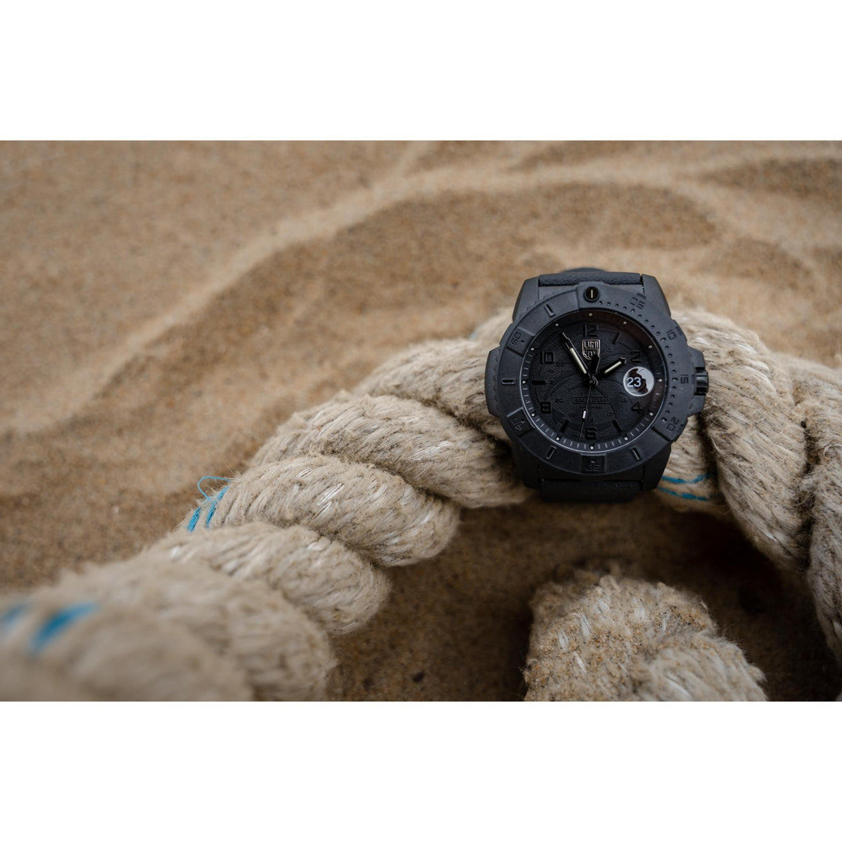 Luminox Navy SEAL quartz watch on wrist with dark rubber band and date window