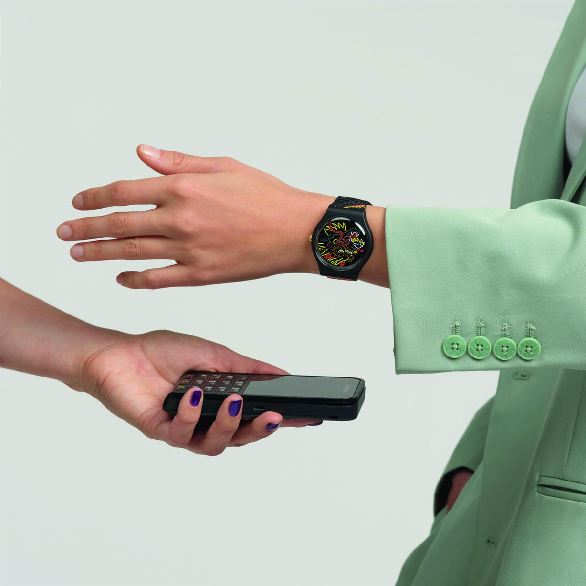 Dragon-themed silicone watch on wrist with colorful dial