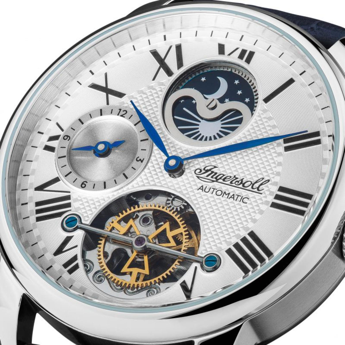 Close-up of silver dial automatic men’s watch with blue moon phase and roman numerals
