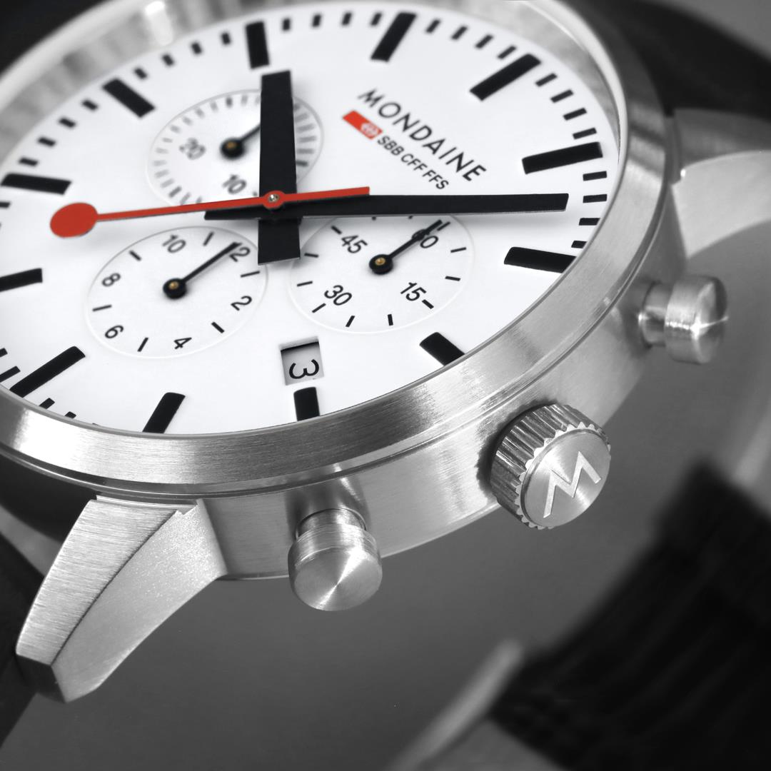 Mondaine chronograph watch with white dial and silver case, side crown and pushers