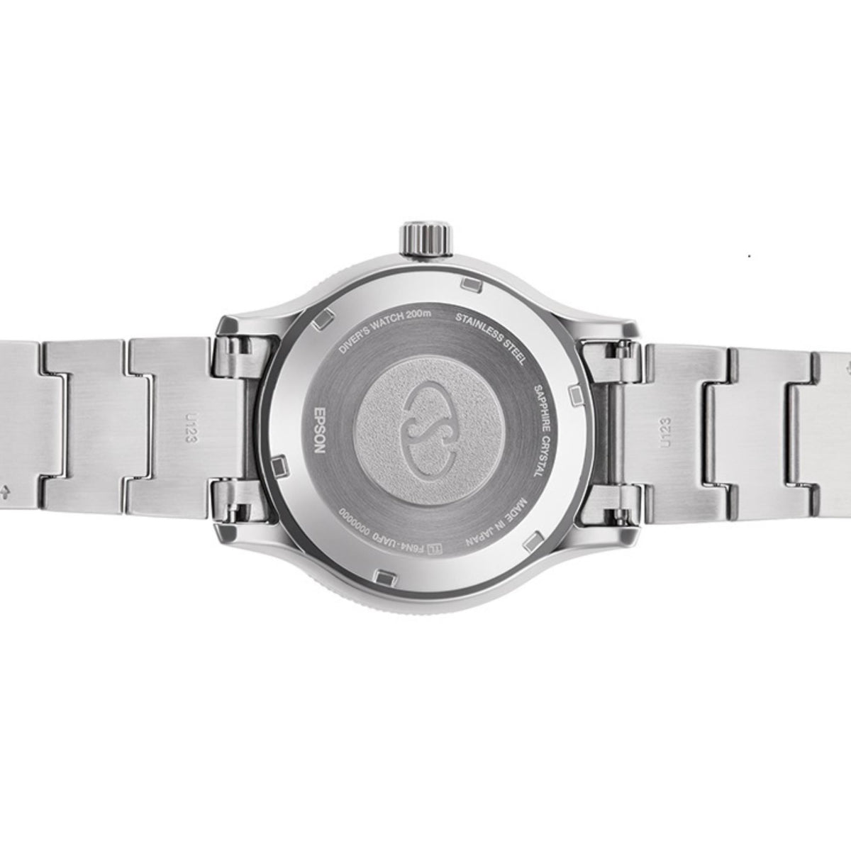 Steel watch caseback close-up with brushed back plate on metal bracelet