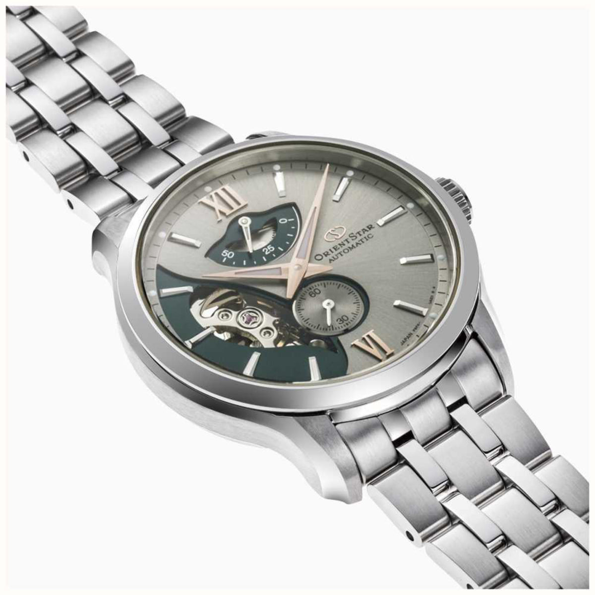 Men's steel automatic watch angled view, grey dial with teal subdials, Roman markers, skeleton movement