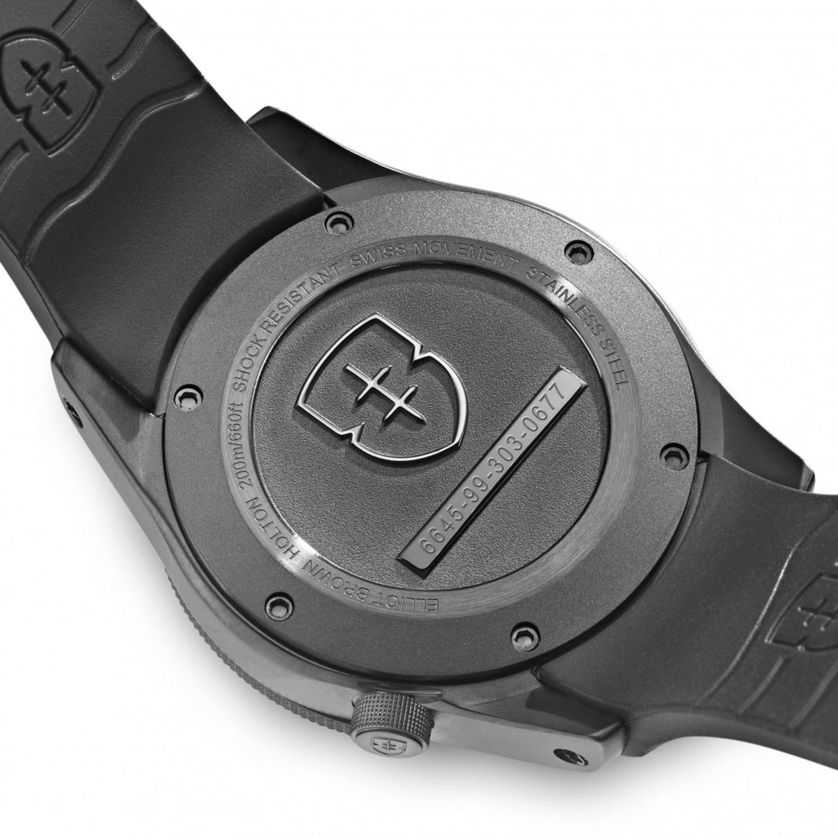 Black rubber strap watch caseback with metal backplate, screws, and engraved logo