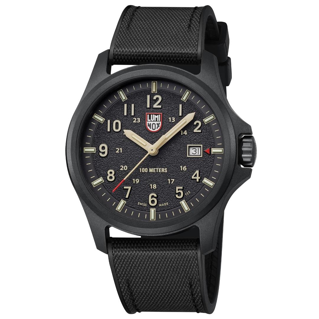 Black quartz field watch with textured black strap, black dial, and date window at 3