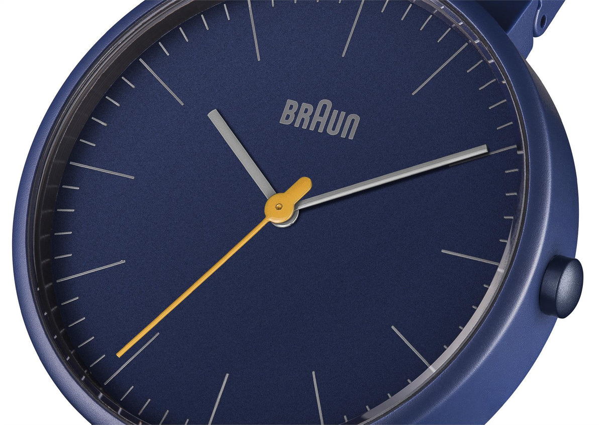 Braun Quartz watch close-up: navy blue dial with gold hands and markers