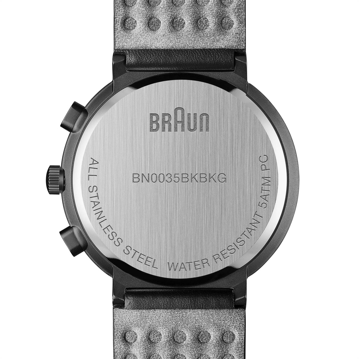 Stainless steel watch caseback with water resistance text and black leather strap
