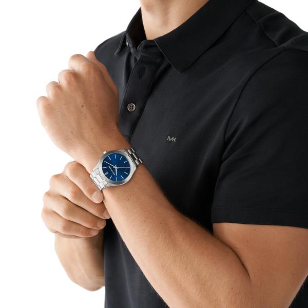 Michael Kors Slim Runway MK1060SET lifestyle shot featuring blue dial steel strap men's watch worn on wrist