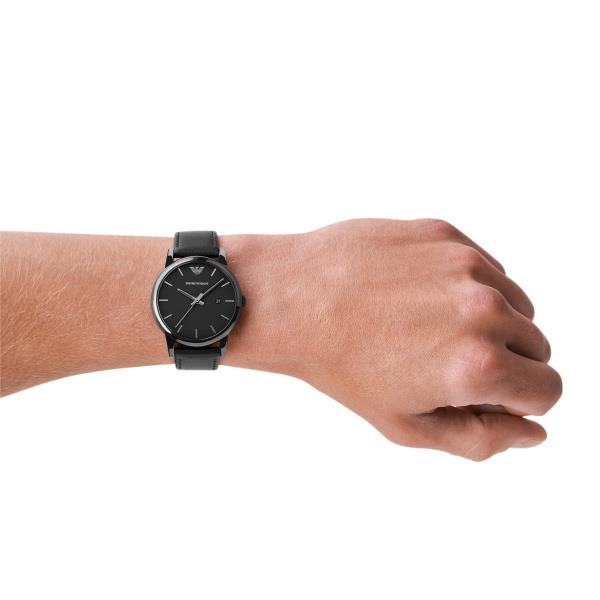 Men's Emporio Armani quartz watch on wrist with black leather strap and black dial