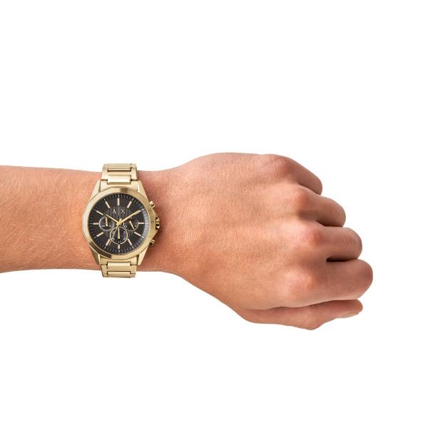 Armani Exchange men's chronograph watch on wrist, gold bracelet, black dial with subdials