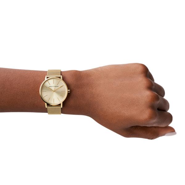 Armani Exchange Lola AX5536 lifestyle wrist shot showcasing ladies gold dial watch with a mesh bracelet