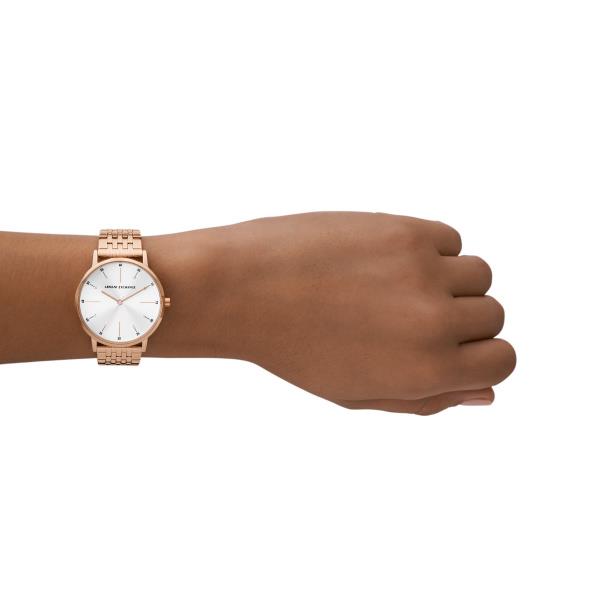 Ladies rose-gold quartz watch on wrist with white sunburst-style dial