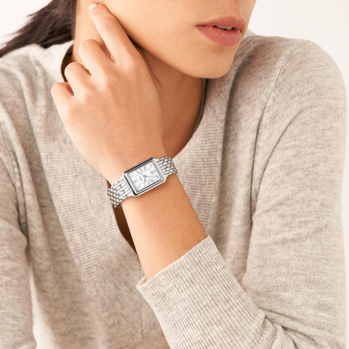 On-wrist lifestyle shot of the Fossil Raquel ES5221 ladies quartz watch highlighting the silver dial display and stainless steel strap