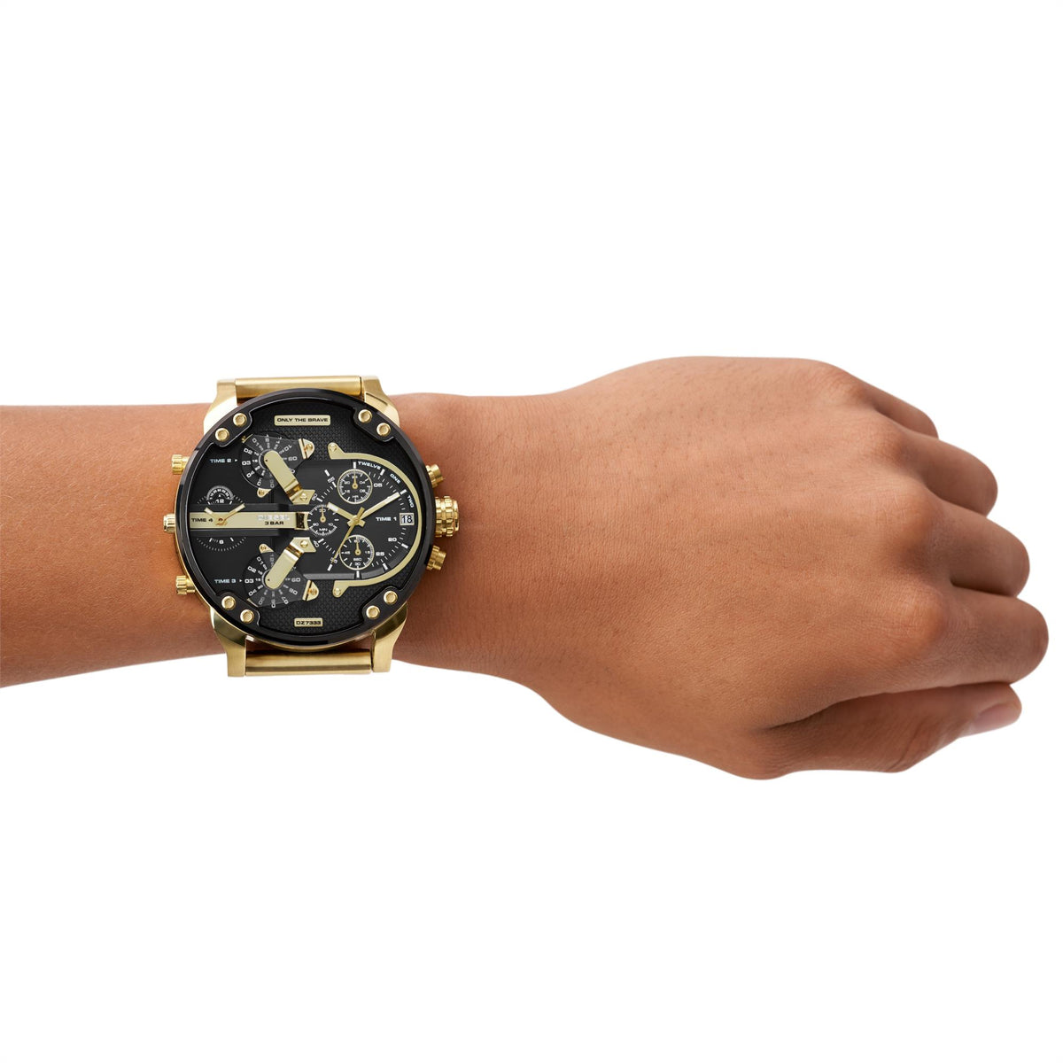 Gold-tone chronograph wristwatch with black dial and three subdials on wrist