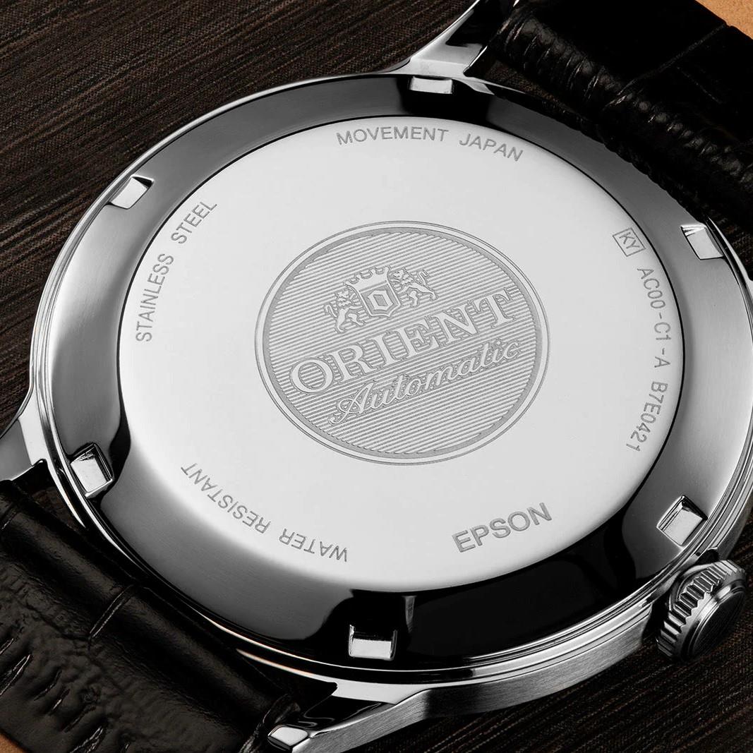 Stainless steel caseback with engraved movement text and automatic logo, black strap watch