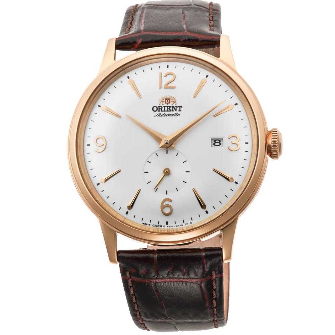 Gold-tone automatic wristwatch with white dial and brown leather strap