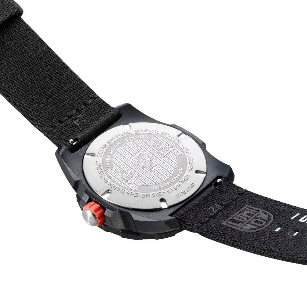 Back of black sports quartz watch with engraved case and black fabric strap
