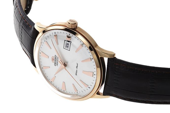 Men's automatic watch angled view: white dial, rose-gold case, black leather strap