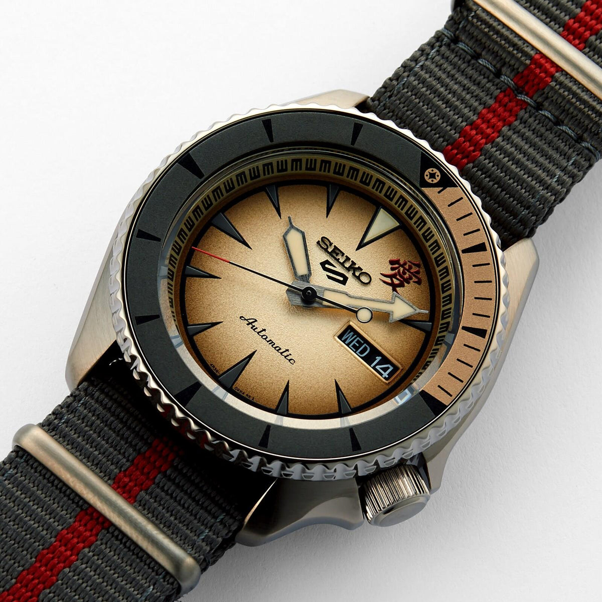 Angled top view of the Seiko 5 Sports Limited Edition watch showing the gradient sand-colored dial and Nylon strap.